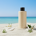Ocean View Body Lotion in rice husk bottle with black lid on white sand with ocean backdrop