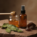Smoked Honey Room Mist - amber bottle with honey, amber crystals and patchouli props