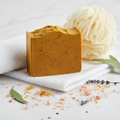 Radiant Root Beauty Bar - deep golden turmeric soap bar with bath puff and salt crystals