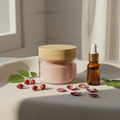 Timeless Rose Face Scrub and Mask in glass jar with wooden lid, rosehip berries and rose petals