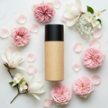 Sheer Petal Body Lotion in a rice husk bottle with soft floral props