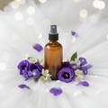 Wedding Day Room Mist - amber bottle on white tulle with purple violets and jasmine blooms
