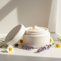 Calm n' Glow Body Butter Balm with lavender and chamomile in soft window light