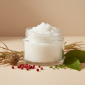 Whiskey Sage Body Scrub Travel Size in a clear 2oz jar with no label, with vetiver, pink peppercorns and patchouli props