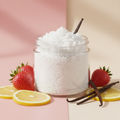 Strawberry Cream Body Scrub Travel Size in a clear 2oz jar with no label, with strawberries, lemon and vanilla bean props