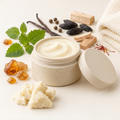 Light Sinful Allure balm image with washcloth, shea butter, and scent-note props